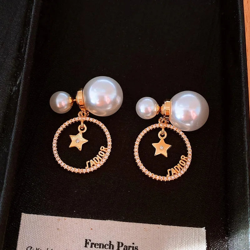 Angled view of the 14K Gold-Plated Elegant Zircon Star Pearl Two-Piece Earrings