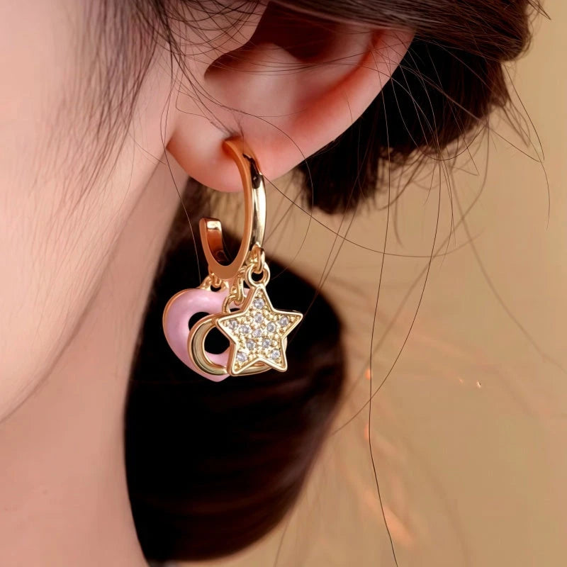 Close-up detail of the sparkling zircons and plating on the Heart Tassel Earrings