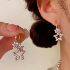 Angled view of the 14K Gold-Plated Elegant Zircon Star Tassel Earrings