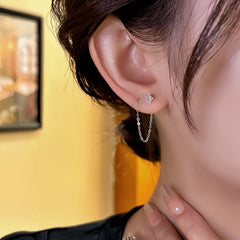 Close-up detail of the sparkling zircons and plating on the Star Threader Earrings