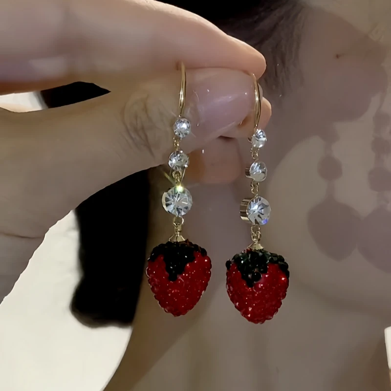 Close-up detail of the sparkling zircons and plating on the Strawberry Ear Hooks