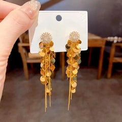 Angled view of the 14K Gold-Plated Elegant Zircon Sun Flower Tassel Earrings