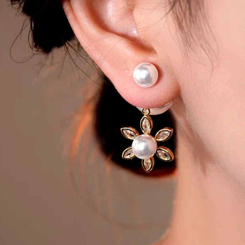 Close-up detail of the sparkling zircons and plating on the Sun Pearl Jacket Earrings