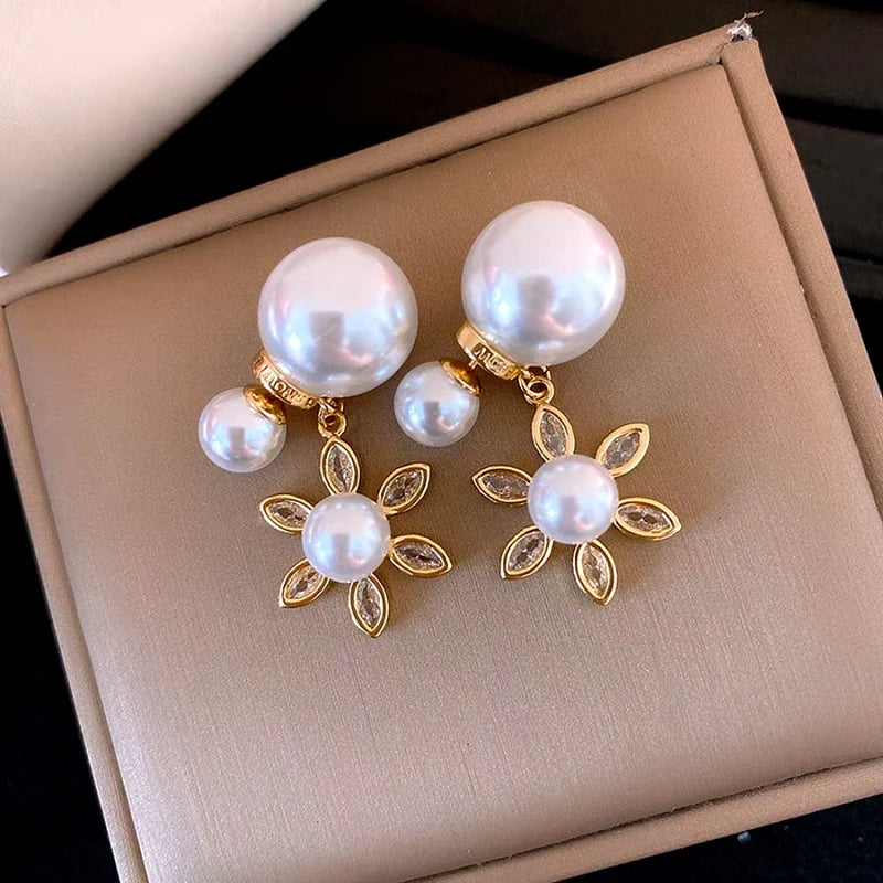 Angled view of the 14K Gold-Plated Elegant Zircon Sun Pearl Jacket Earrings