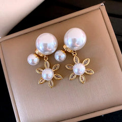 Angled view of the 14K Gold-Plated Elegant Zircon Sun Pearl Jacket Earrings