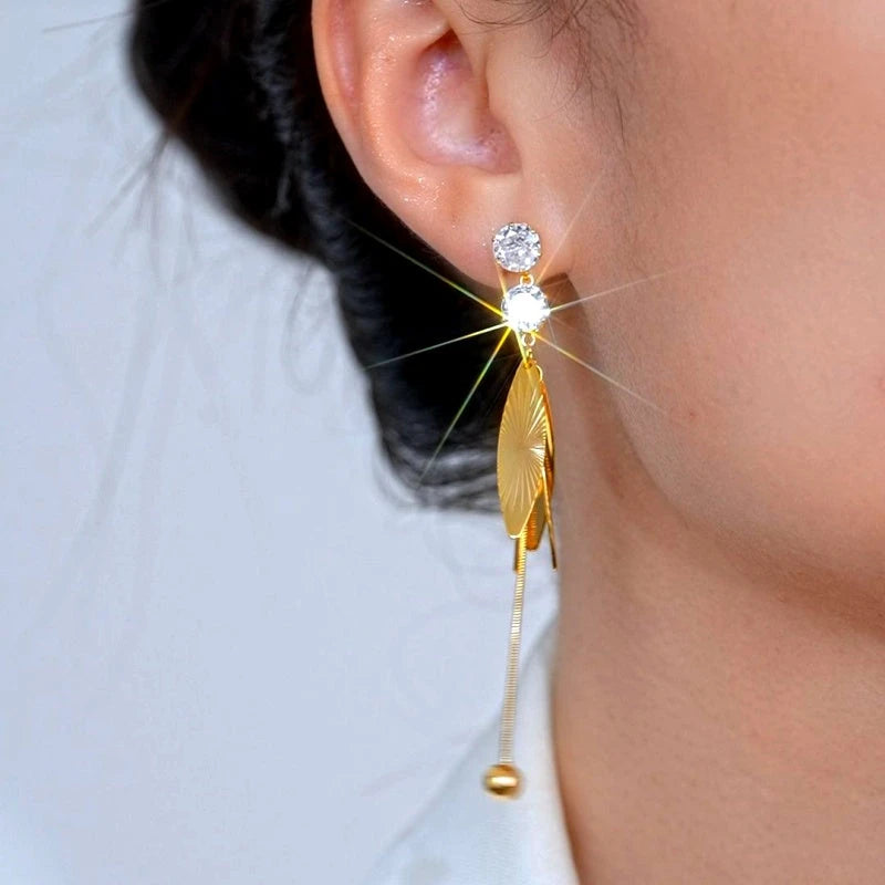 Close-up detail of the sparkling zircons and plating on the Wing Tassel Earrings