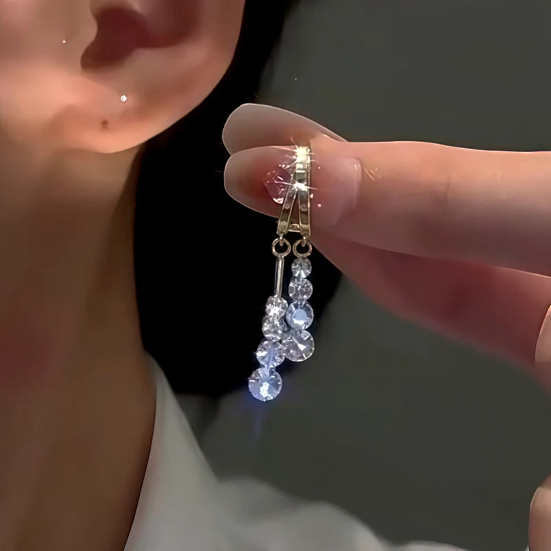 Angled view of the 14K Gold-Plated Elegant Zircon Tassel Earrings