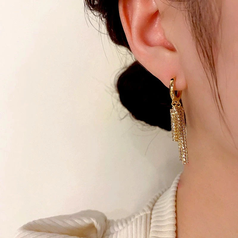 Close-up detail of the sparkling zircons and plating on the Chain Tassel Earrings