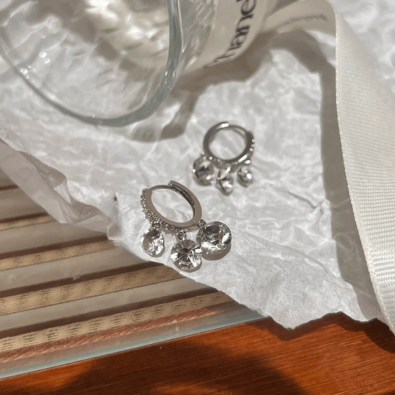 Angled view of the 14K Gold-Plated Elegant Zircon Tassel Earrings