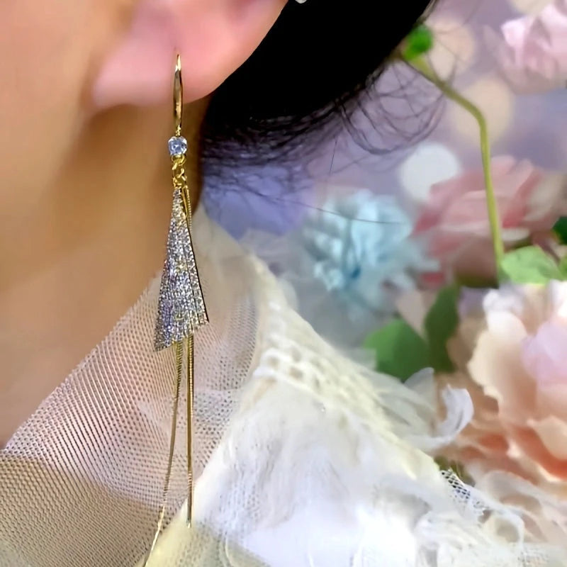 Close-up detail of the sparkling zircons and plating on the Triangle Tassel Earrings