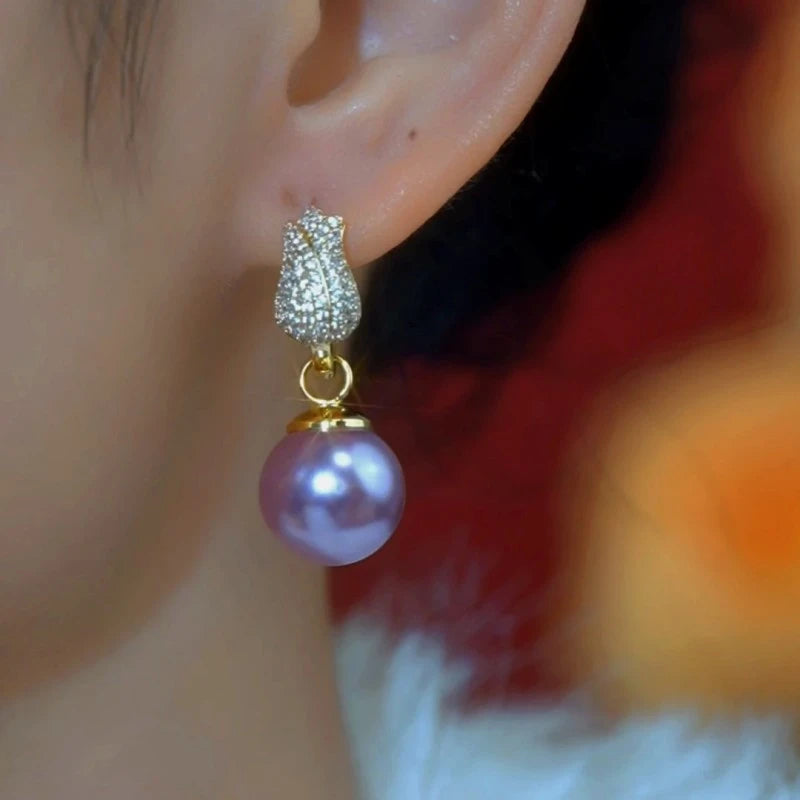 Close-up detail of the sparkling zircons and plating on the Tulip Pearl Earrings