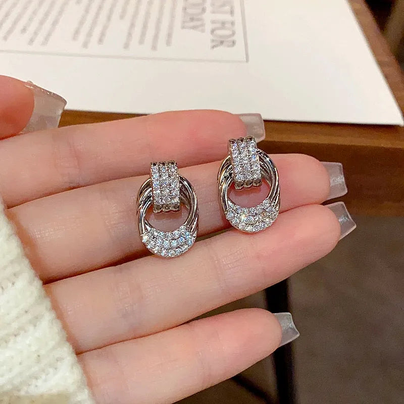 Angled view of the 14K Gold-Plated Elegant Zircon Twisted Earrings