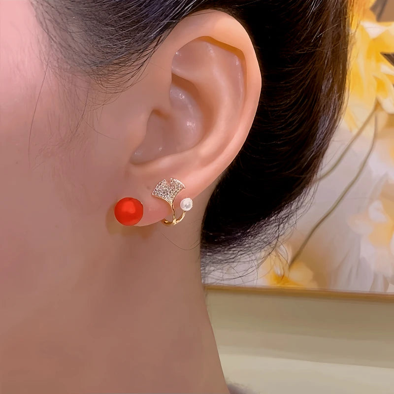 Close-up detail of the sparkling zircons and plating on the Ginkgo Leaf Earrings