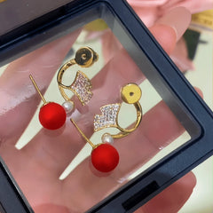 Angled view of the 14K Gold-Plated Elegant Zircon Two-Piece Ginkgo Leaf Earrings