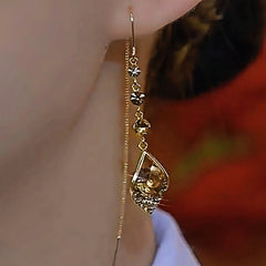 Close-up detail of the sparkling zircons and plating on the Brown Water Drop Earrings