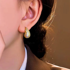Model showcasing the dangle and style of the 14K Gold-Plated Elegant Zircon Water Drop Earrings