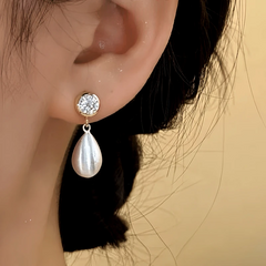 Close-up detail of the sparkling zircons and plating on the Open Teardrop Earrings