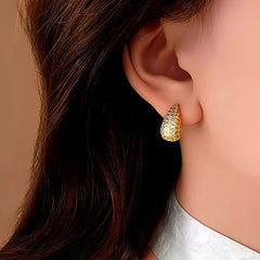 Close-up detail of the sparkling zircons and plating on the Water Drop Stud Earrings