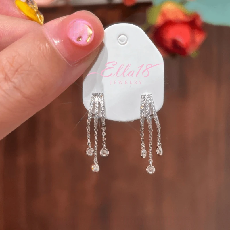 Angled view of the 14K Gold-Plated Elegant Zircon Water Drop Tassel Earrings