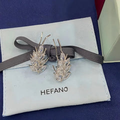 Close-up detail of the sparkling zircons and plating on the Wheat Crawler Earrings