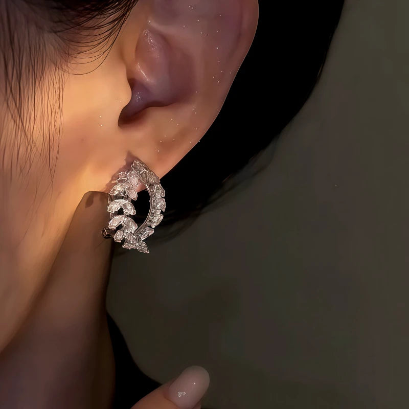 Model showcasing the dangle and style of the 14K Gold-Plated Elegant Zircon Wheat Earrings