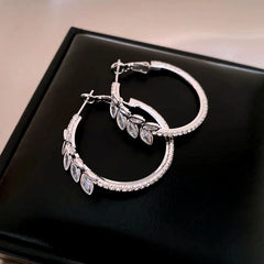 Close-up detail of the sparkling zircons and plating on the Wheat Hoop Earrings
