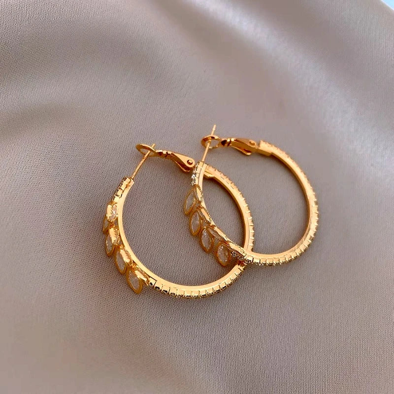 Angled view of the 14K Gold-Plated Elegant Zircon Wheat Hoop Earrings