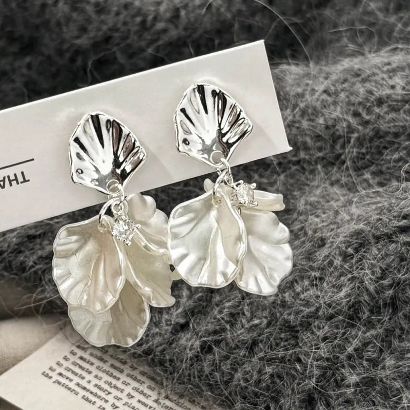 Close-up detail of the sparkling zircons and plating on the Petal Tassel Earrings