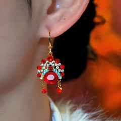 Model showcasing the dangle and style of the 14K Gold-Plated Elegant Zircon Wreath Tassel Earrings