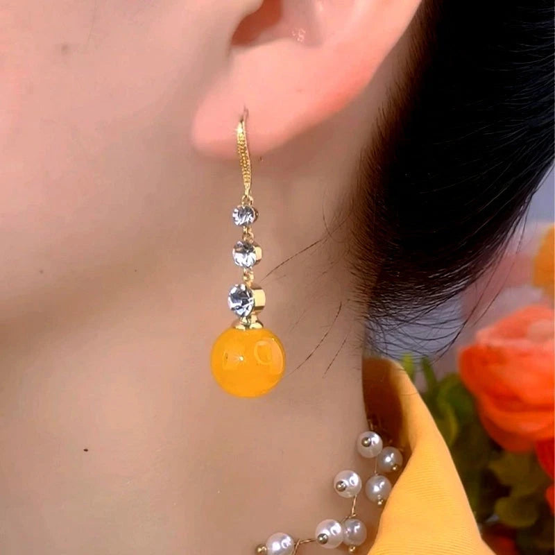 Close-up detail of the sparkling zircons and plating on the Yellow Bead Ear Hooks