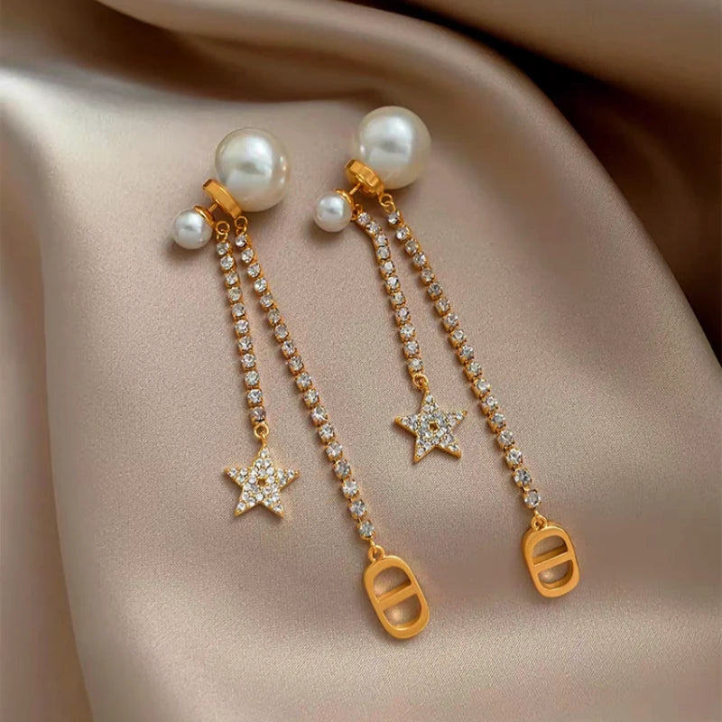 Angled view of the 14K Gold-Plated Elegant Zircon Zircon Star Pearl Earrings