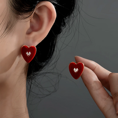 Close-up detail of the sparkling zircons and plating on the Red Heart Stud Earrings