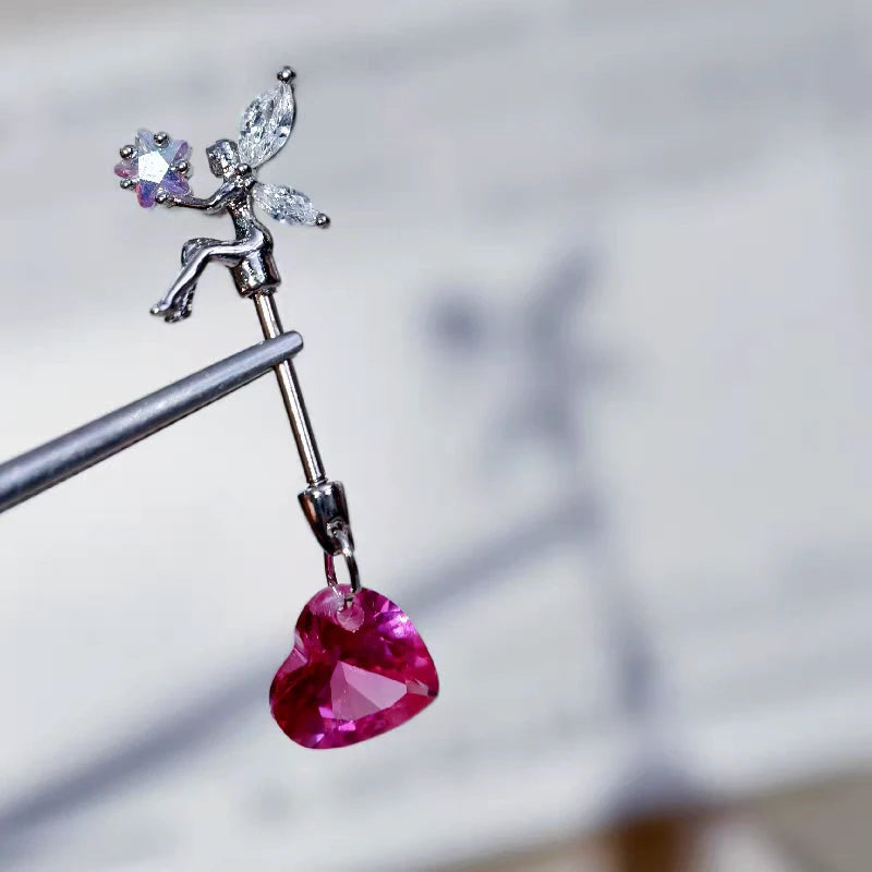 Close-up detail of the sparkling zircons and plating on the Elf Heart Earrings
