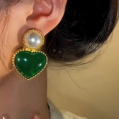 Close-up detail of the sparkling zircons and plating on the Emerald Heart Earrings