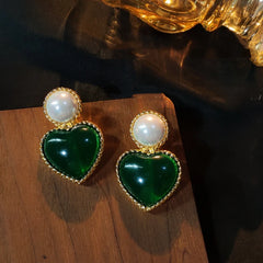 Angled view of the 14K Gold-Plated Emerald Heart Earrings