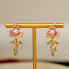 Angled view of the 18K Gold-Plated Enamel Oil-Drop Flower Pearl Earrings