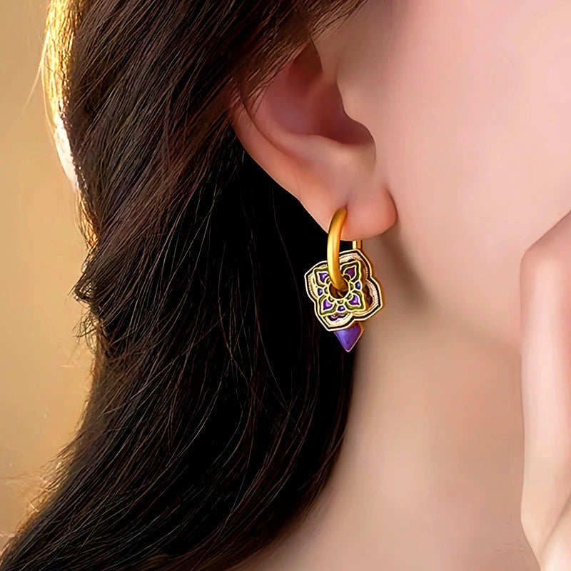 Model showcasing the dangle and style of the 14K Gold-Plated Enamel Purple Drip Earrings
