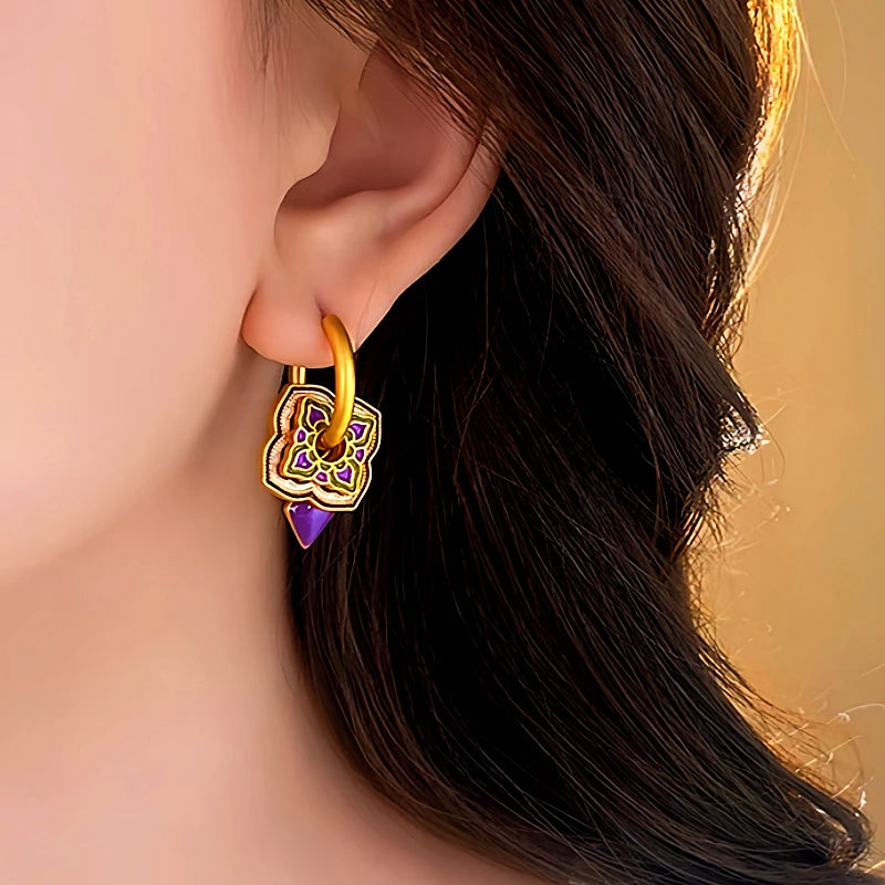 Angled view of the 14K Gold-Plated Enamel Purple Drip Earrings