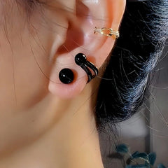 Model showcasing the dangle and style of the 14K Gold-Plated Exquisite Black Pearl Stud Earrings