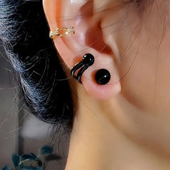 Close-up detail of the sparkling zircons and plating on the Black Pearl Studs