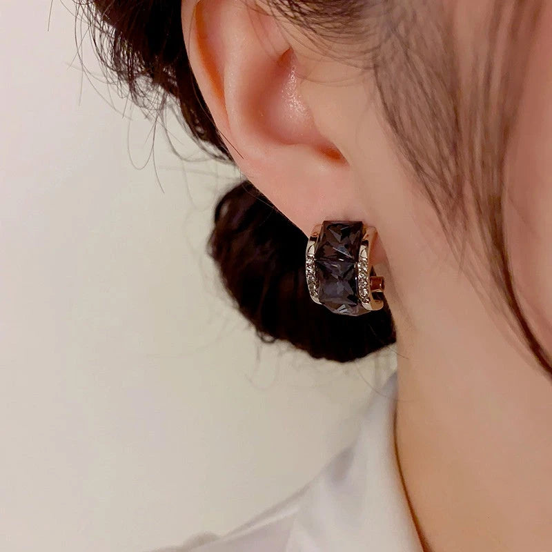 Angled view of the 14K Gold-Plated Exquisite Black Square Diamond Earrings