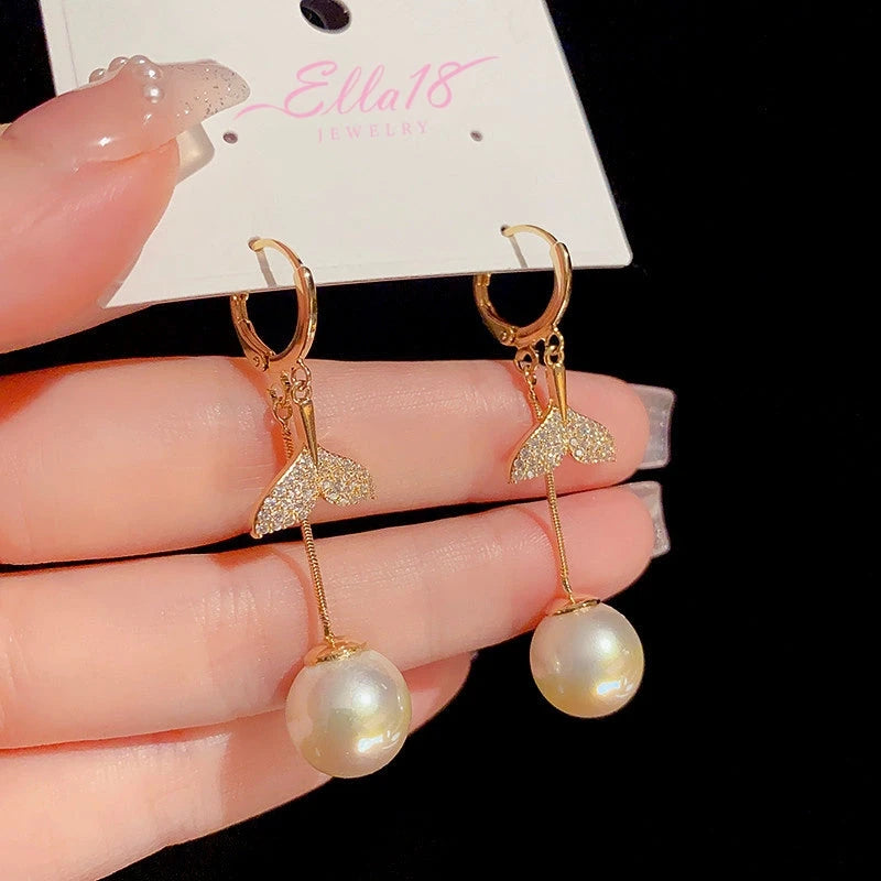 Close-up detail of the sparkling zircons and plating on the Fishtail Pearl Tassel Earrings