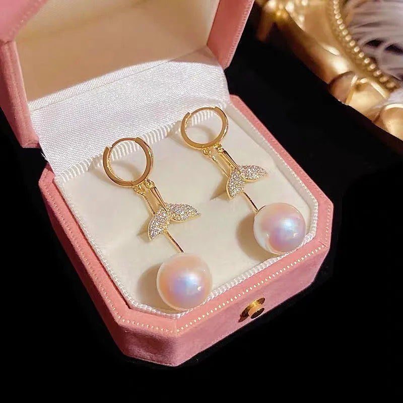 Angled view of the 14K Gold-Plated Exquisite Diamond-Filled Fishtail Pearl Tassel Earrings