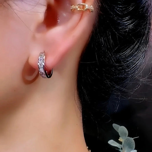 Model showcasing the dangle and style of the 14K Gold-Plated Exquisite Diamond Hoop Earrings Earrings