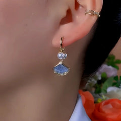 Close-up detail of the sparkling zircons and plating on the Ginkgo Leaf Pearl Earrings