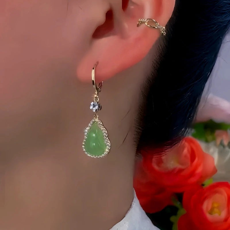Close-up detail of the sparkling zircons and plating on the Green Gourd Earrings