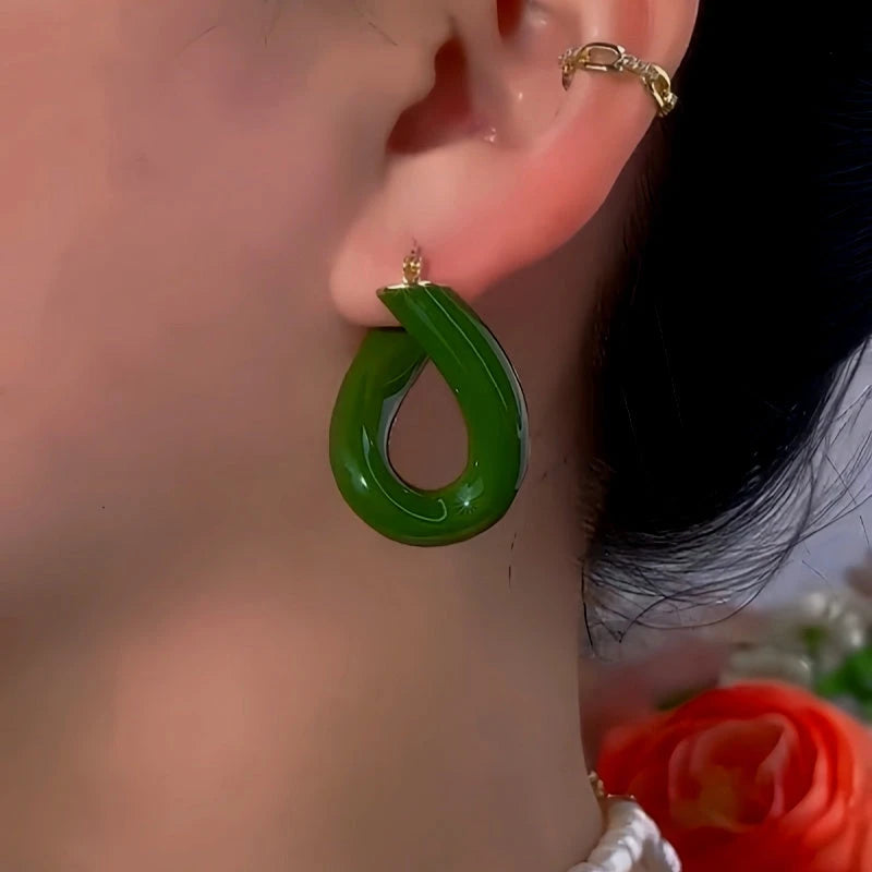 Close-up detail of the sparkling zircons and plating on the Green Oil Drop Earrings