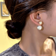 Model showcasing the dangle and style of the 14K Gold-Plated Exquisite Imitation Pearl Earrings
