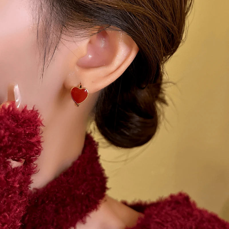 Close-up detail of the sparkling zircons and plating on the Red Heart Hoop Earrings