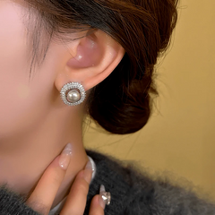 Model showcasing the dangle and style of the 14K Gold-Plated Exquisite Smoky Gray Square Bead Stud Earrings